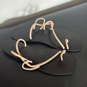 A. Emery Flat Sandals
